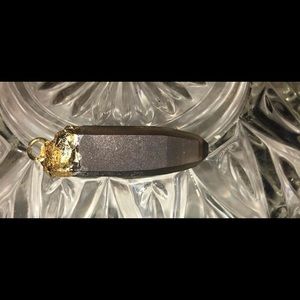 Smoky quartz crystal wrapped in 24 karat leaf